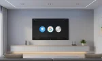 Modern living room with a 4K smart TV compatible with Alexa, Google Assistant and Siri, showing a voice enabled smart TV setup without people.